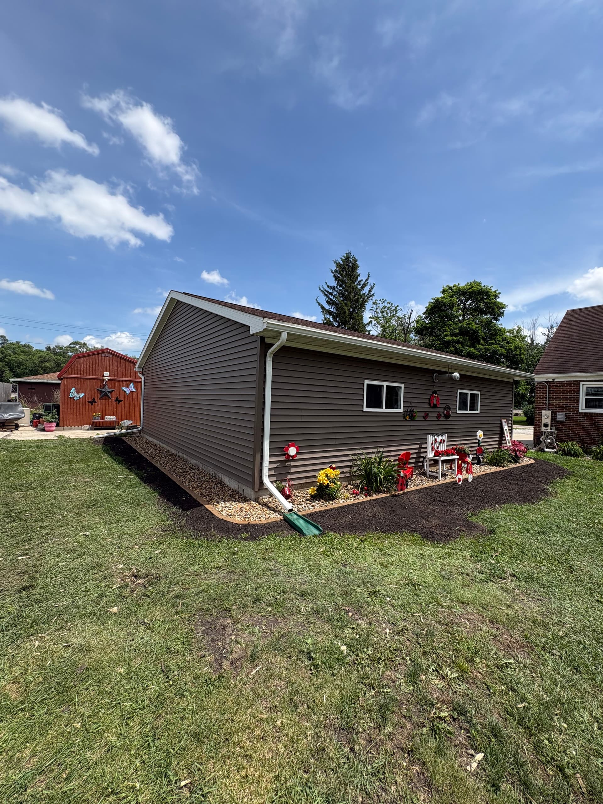 Gallery photos for Flower Bed Extension with River Rock and Fresh Mulch: Image #3