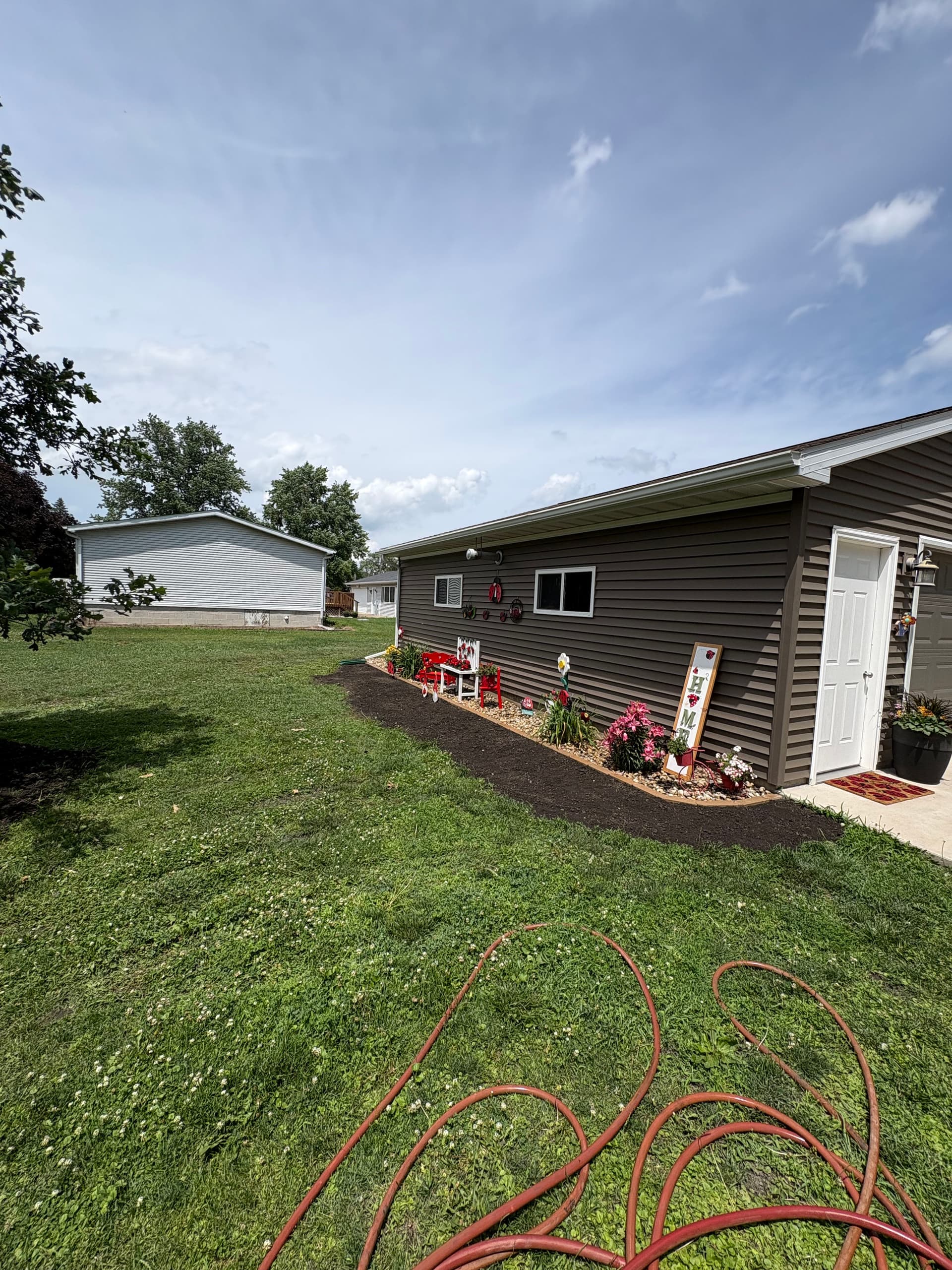 Gallery photos for Flower Bed Extension with River Rock and Fresh Mulch: Image #2