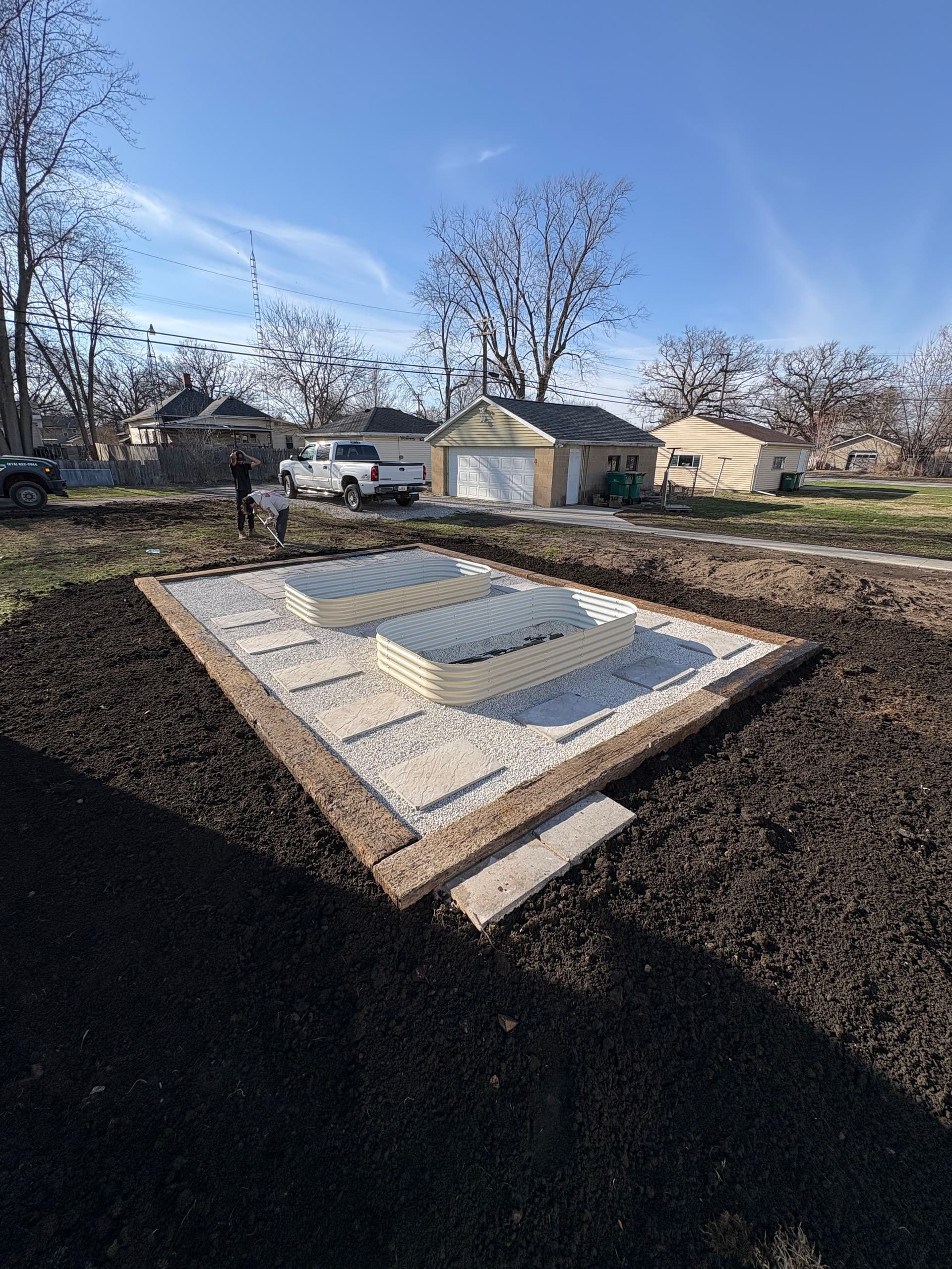 Stunning Raised Flower Beds with a Paver Pad Install in Streator