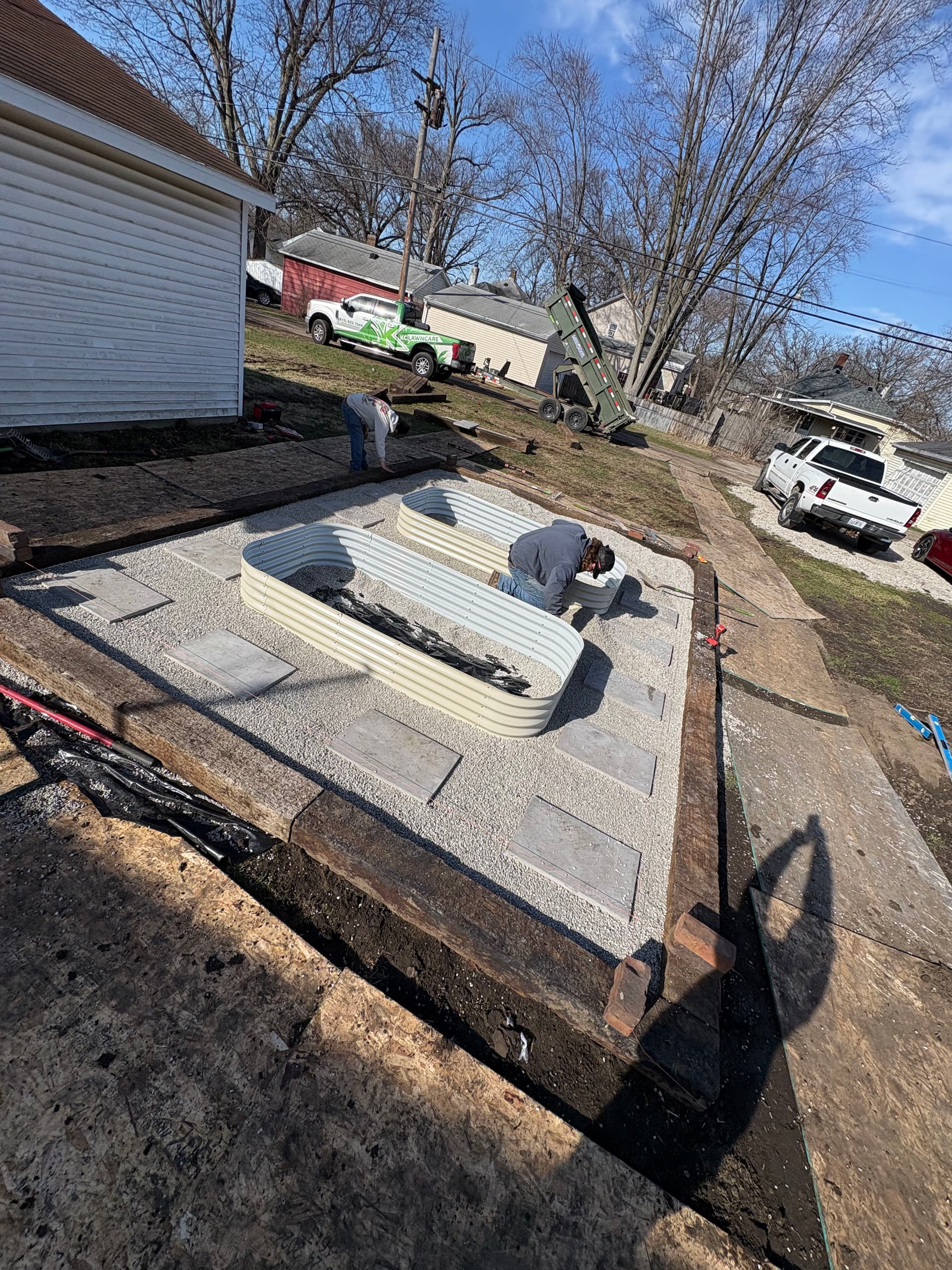 Stunning Raised Flower Beds with a Paver Pad Install in Streator