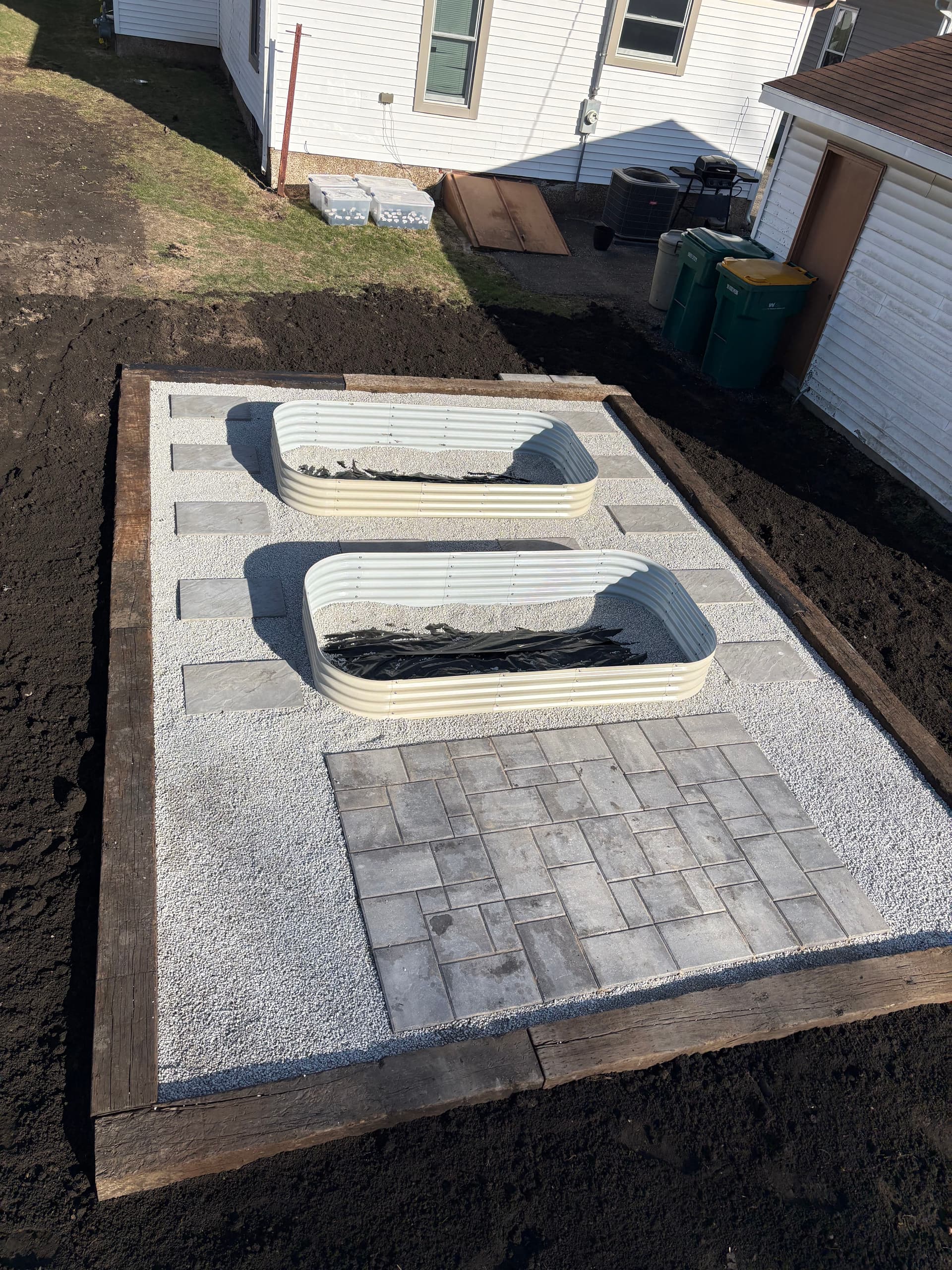 Stunning Raised Flower Beds with a Paver Pad Install in Streator