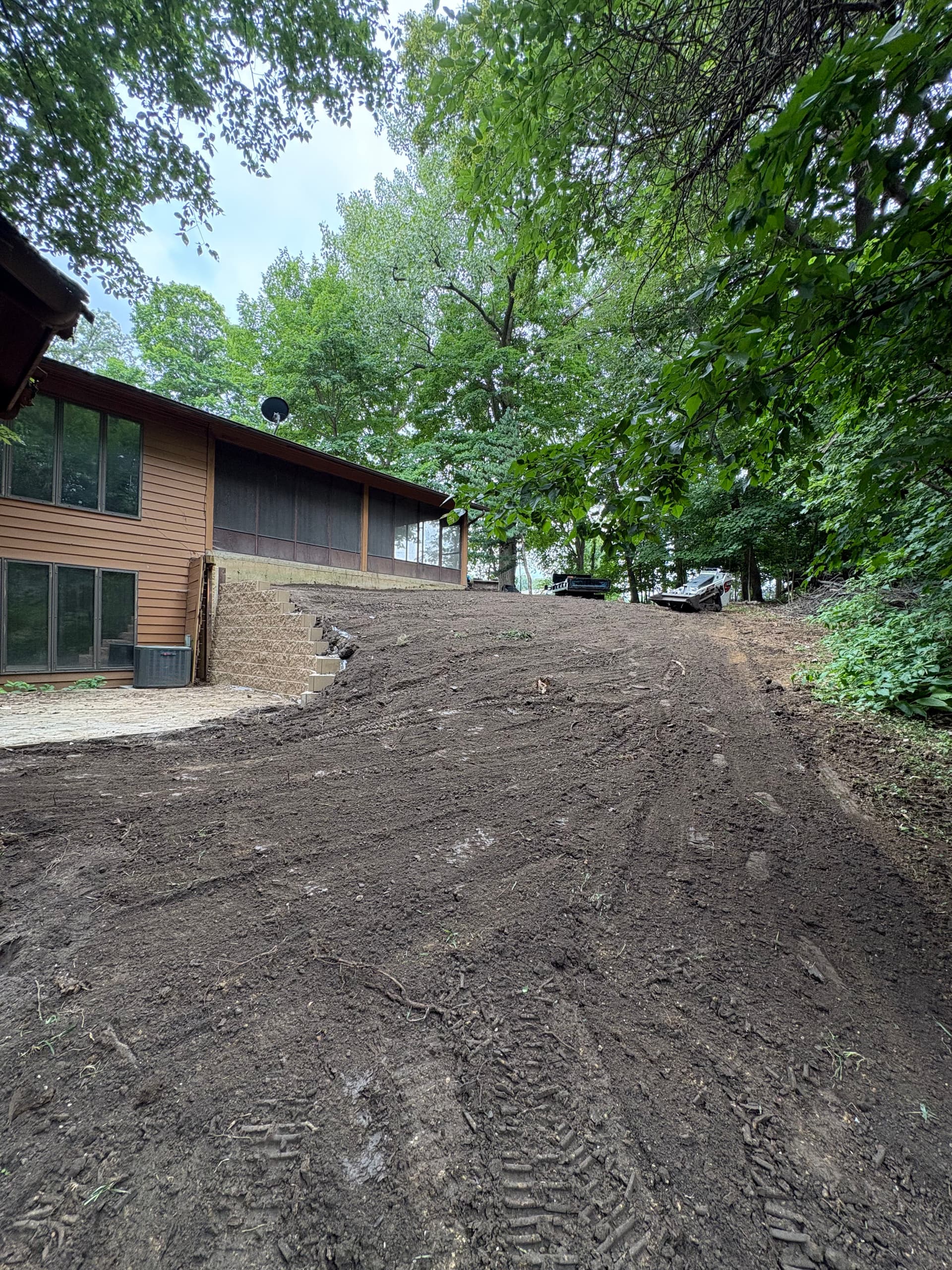 Gallery photos for Retaining Wall and Drainage Fix Along a Sloped House Foundation: Image #3