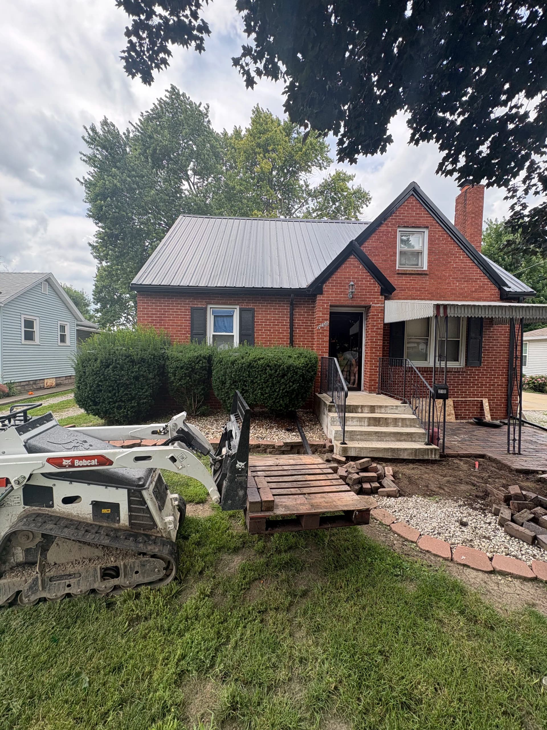 Paver Walkway and Retaining Wall Upgrade on a Brick Home image