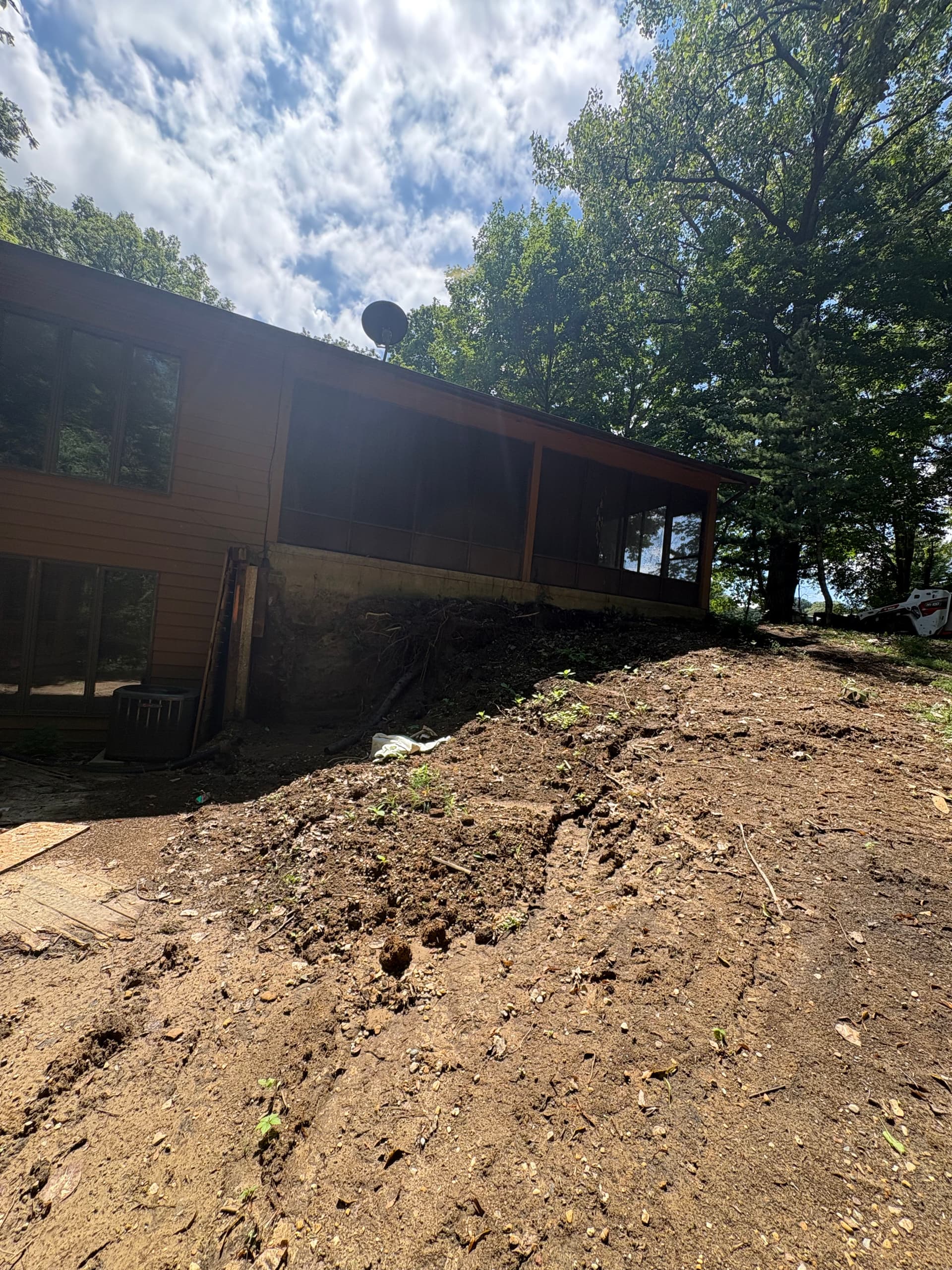 Gallery photos for Retaining Wall and Drainage Fix Along a Sloped House Foundation: Image #2